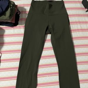 Lululemon high waisted legging in olive. Luxtreme material. Size 4. Mesh sides.